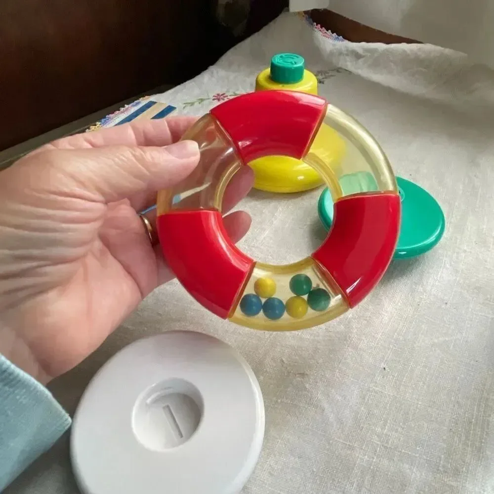 1996, Ring ‘n Roll Gerber Products Co. Toy Biz, Inc roundish rolling rattle infa